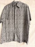 Stylish vintage Murano 100% silk button-front shirt featuring a bold black and white geometric pattern throughout. Lightweight and breathable with a relaxed