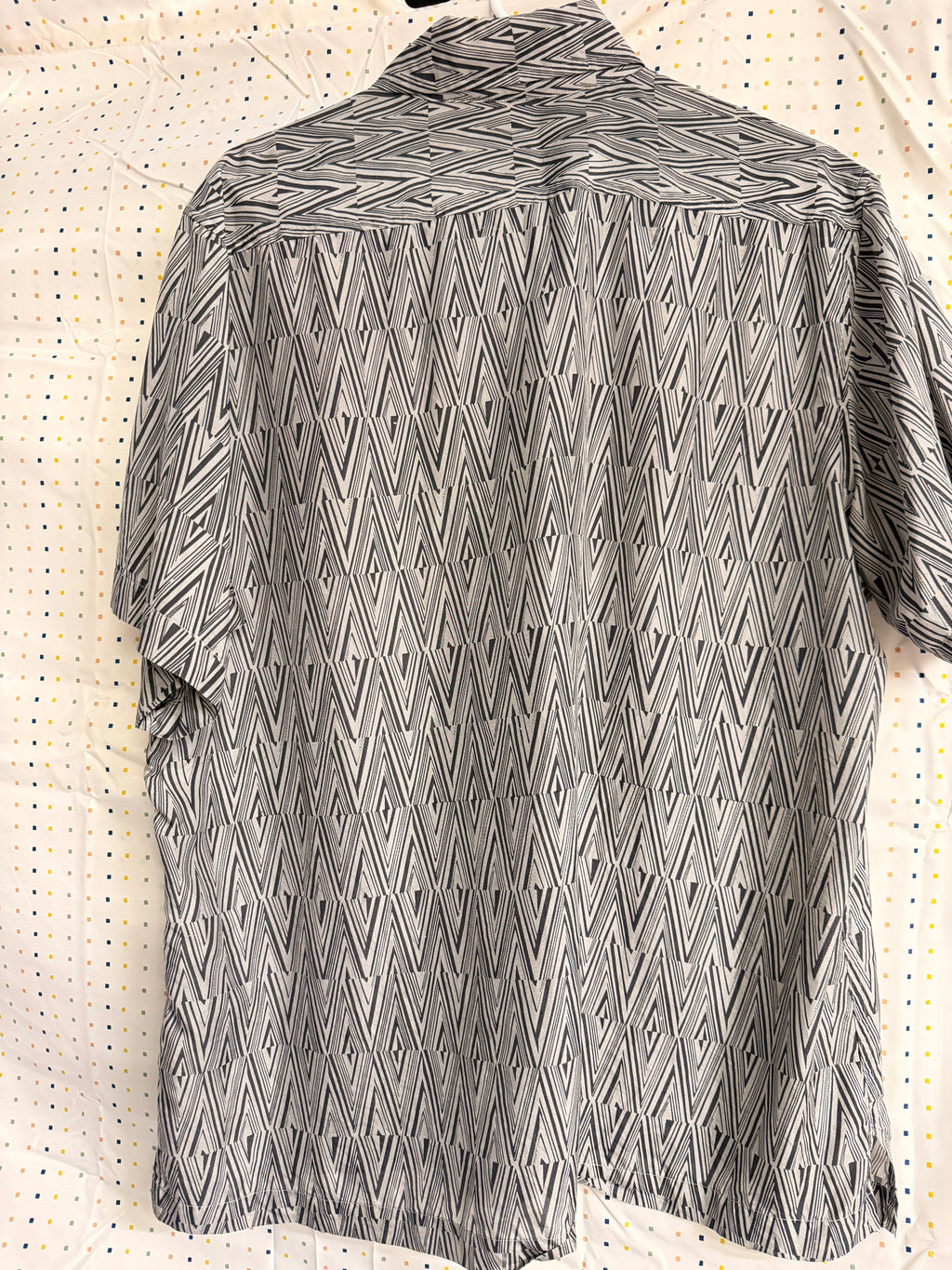Stylish vintage Murano 100% silk button-front shirt featuring a bold black and white geometric pattern throughout. Lightweight and breathable with a relaxed